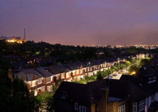 Modern directional environmental street lighting with minimal light pollution on Cranley Gardens at dusk night in Muswell Hill, with Alexandra Palace, London N10, England