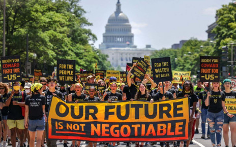 2G5MK0K Demonstrators display signs and a banner during a &quot;No Climate, No Deal&quot; march on the White House, in Washington, DC, U.S., June 28, 2021. REUTERS/Evelyn Hockstein