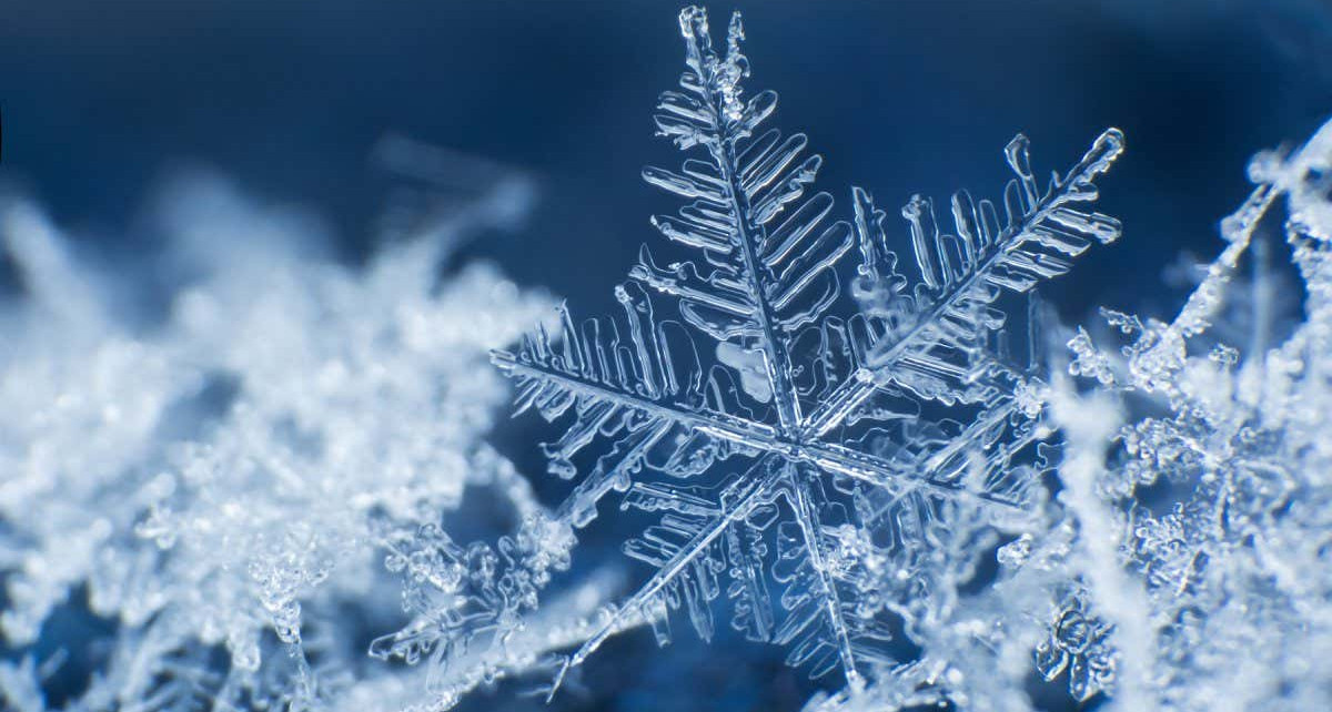 Snowflake on a blue background ; Shutterstock ID 767450926; purchase_order: 04/12/21; job: 18th Dec 21 ; client: NS; other: