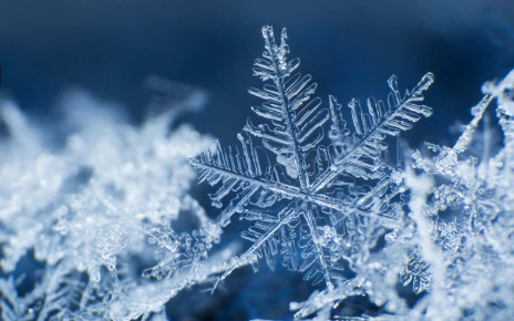 Snowflake on a blue background ; Shutterstock ID 767450926; purchase_order: 04/12/21; job: 18th Dec 21 ; client: NS; other: