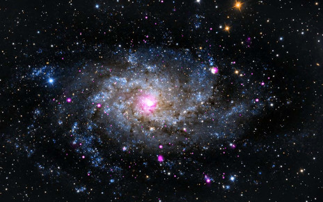 The Triangulum Galaxy, a.k.a., Messier 33, is a spiral galaxy about 3 million light years from Earth. It belongs to the Local Group of galaxies that includes the Milky Way and Andromeda galaxies. Chandra's X-ray data (pink) reveal a diverse range of objects including neutron stars and black holes that are pulling material from a companion star, and supernova remnants. An optical image from the Subaru telescope in Hawaii (red, green, and blue) shows the majestic arms of this spiral galaxy that in many ways is a cousin to our own Milky Way.