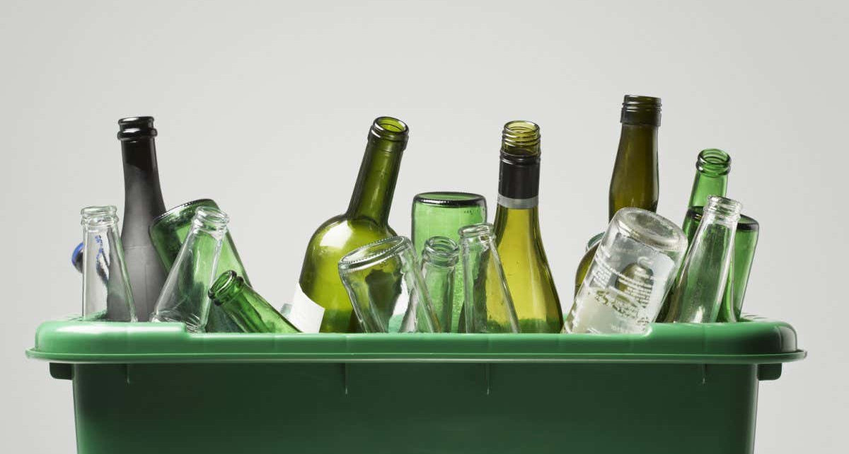 Empty bottles in green container; Shutterstock ID 145222138; purchase_order: 08 Jan 2021 issue; job: 08 Jan 2021 - Feature; client: Photo; other:
