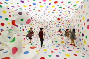 SINGAPORE - JUNE 06: Visitors stand inside Japanese artist, Yayoi Kusama metal, fibreglass, urethane, paint, stickers installation titled &#039;With All My Love for Tulips, I Pray Forever 2013&#039; during a media preview at National Gallery Singapore on June 6, 2017 in Singapore. Yayoi Kusama: Life is the Heart of a Rainbow exhibition features over 120 works spanning 70 years of Kusama&#039;s artistic practise. The exhibition runs from June 9 to September 3, 2017. (Photo by Suhaimi Abdullah/Getty Images)