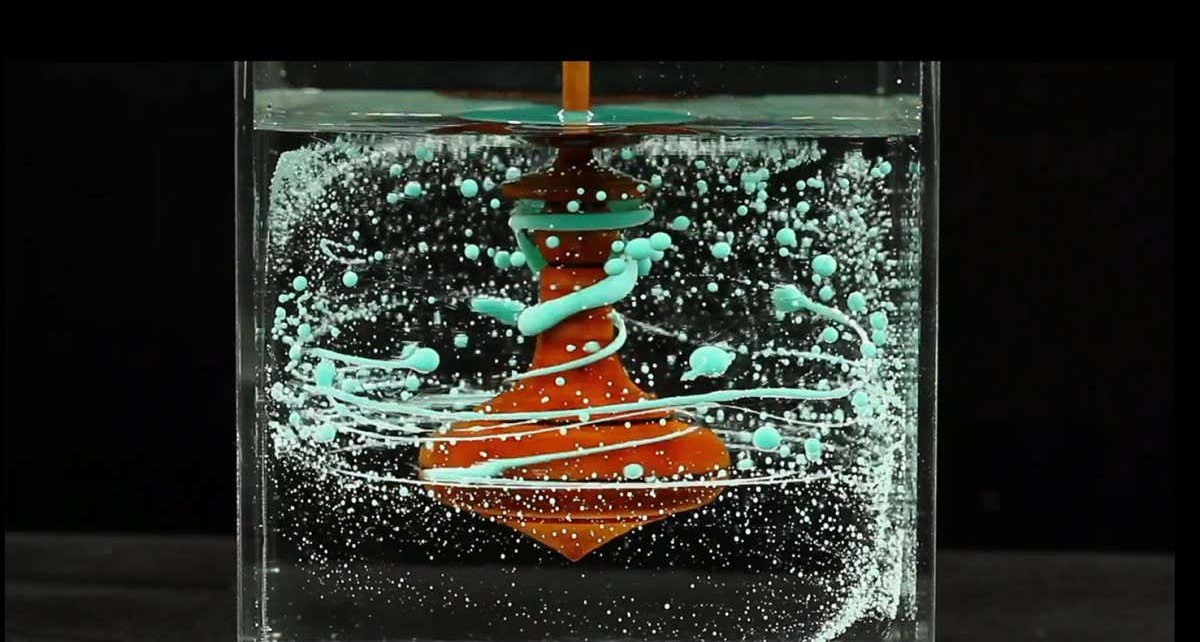 Spectacular liquid fractal generated by a submerged spinning top