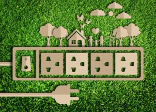 Energy saving concept. Paper cut of eco on green grass; Shutterstock ID 381769096; purchase_order: -; job: -; client: -; other: -