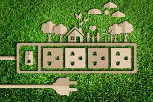 Energy saving concept. Paper cut of eco on green grass; Shutterstock ID 381769096; purchase_order: -; job: -; client: -; other: -