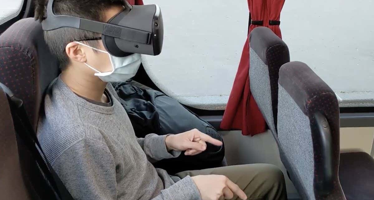 Play VR games on a bus by wiggling your fingers as if they were arms