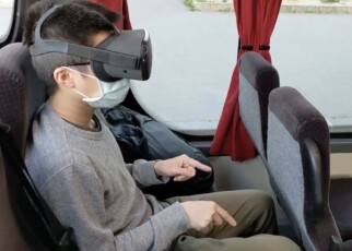 Play VR games on a bus by wiggling your fingers as if they were arms