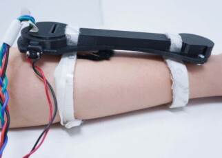Wearable anti-anxiety device strokes your arm with furry a pompom