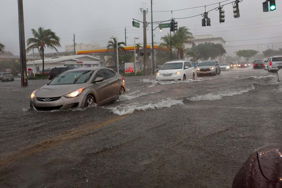 Cars on a flooded street in Dania Beach, Florida on 12 April