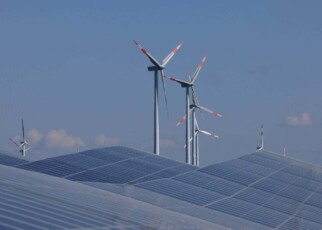 Solar panels and wind turbines at a new solar park near Prenzlau, Germany