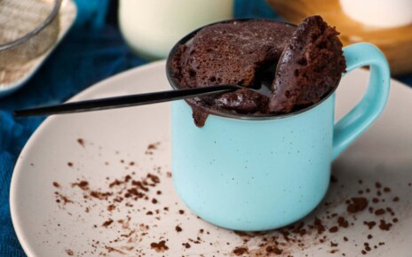 mugcake is microwaved. Homemade cupcake in a mug is on a plate. Chocolate brownie mug cake. Easy cooking concept, microwave baking. muffin chocolate. High quality photo; Shutterstock ID 2030585198; purchase_order: -; job: -; client: -; other: -