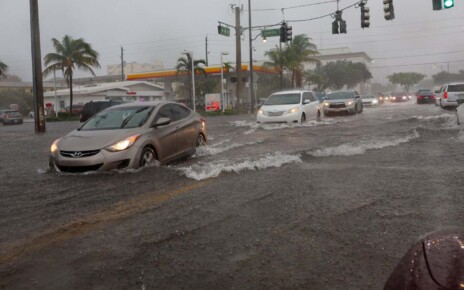 Cars on a flooded street in Dania Beach, Florida on 12 April