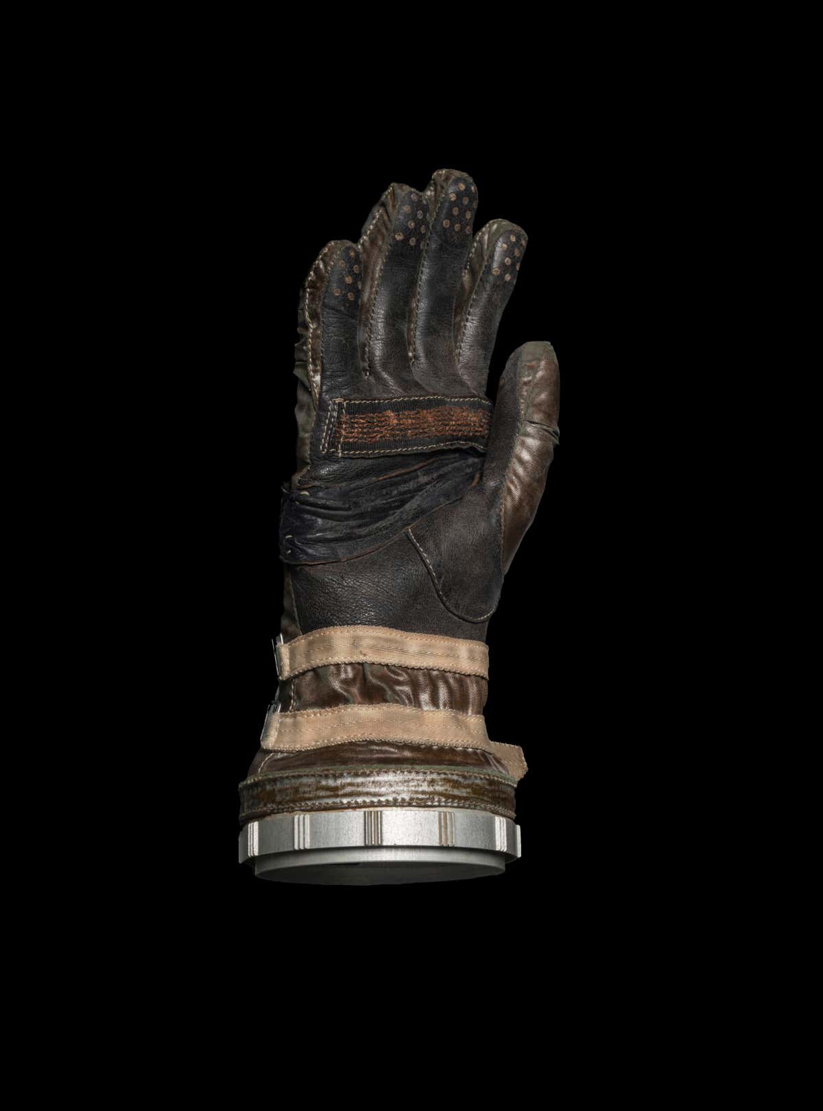 GLOVES IN SPACE Not all space debris is composed of broken rockets and dead satellites. Occasionally astronauts drop things overboard as well. A spacesuit glove similar to this one was lost during a space walk from the Gemini IV mission in 1965. It had been left in the airlock, so when a fully suited Ed White opened the exterior door to make his way outside, the glove floated off as well. Estimates suggest that it spent a month orbiting the Earth before re-entering and burning up.