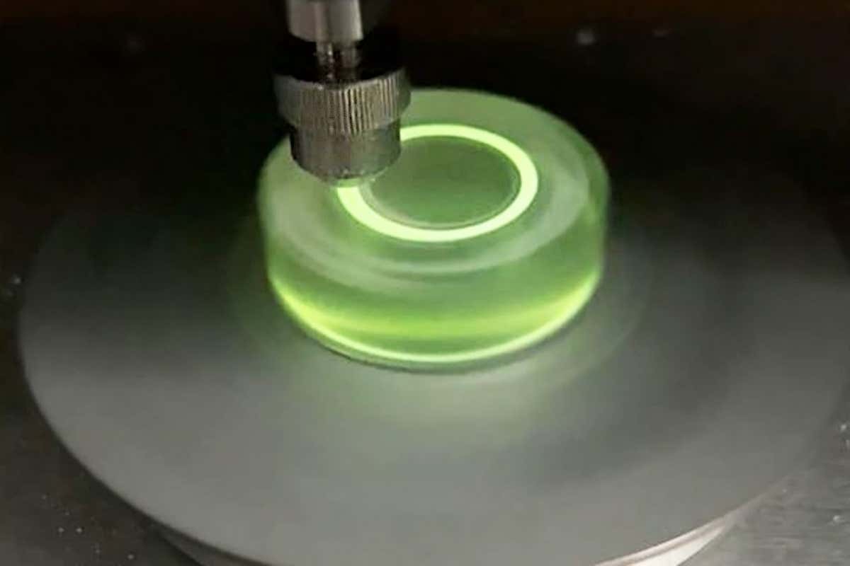 The material glows green under force