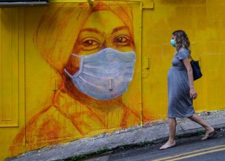 A pregnant woman walking in Hong Kong in March 2020