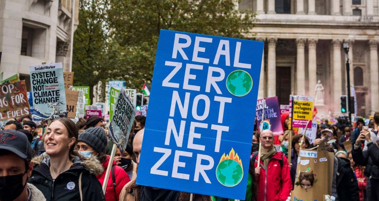 2H57CRH Real zero no net zero placard, Global Day of Action for Climate Justice demonstration, London, UK. 6th November 2021