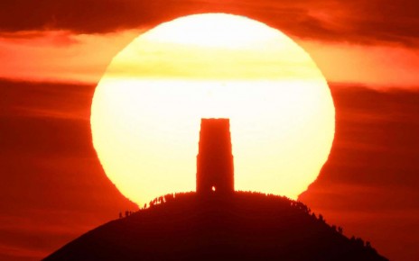 People at Glastonbury Tor in Somerset, UK on the summer solstice