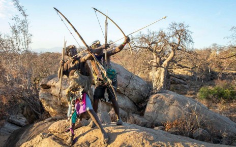 Hadza people with bows and arrows