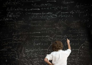 BAM2G8 Boy with formulae on blackboard