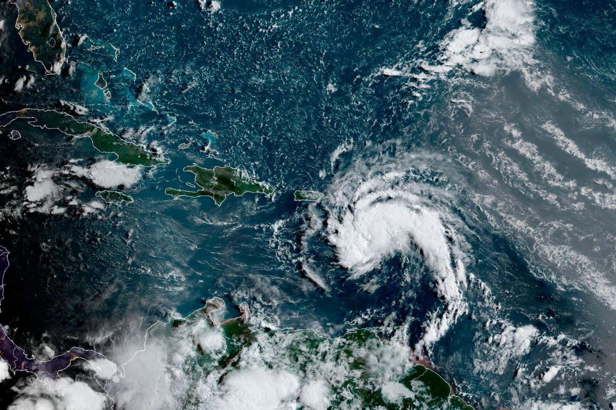 2NMX51D This satellite image provided by the National Oceanic and Atmospheric Administration (NOAA) shows a tropical storm east of Puerto Rico in the Caribbean, at 7:50am EST, Tuesday, Aug. 10, 2021. The National Hurricane Center issued tropical storm warnings for the U.S. Virgin Islands and Puerto Rico, where forecasters expected the potential cyclone to strengthen Tuesday into the sixth named storm, Fred, of the Atlantic hurricane season. (NOAA/NESDIS/STAR GOES via AP)