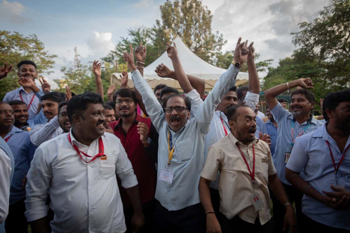 Employees of the Indian Space Research Organisation (ISRO) celebrate after the landing of the Chandrayaan-3 mission on the moon on 23 August