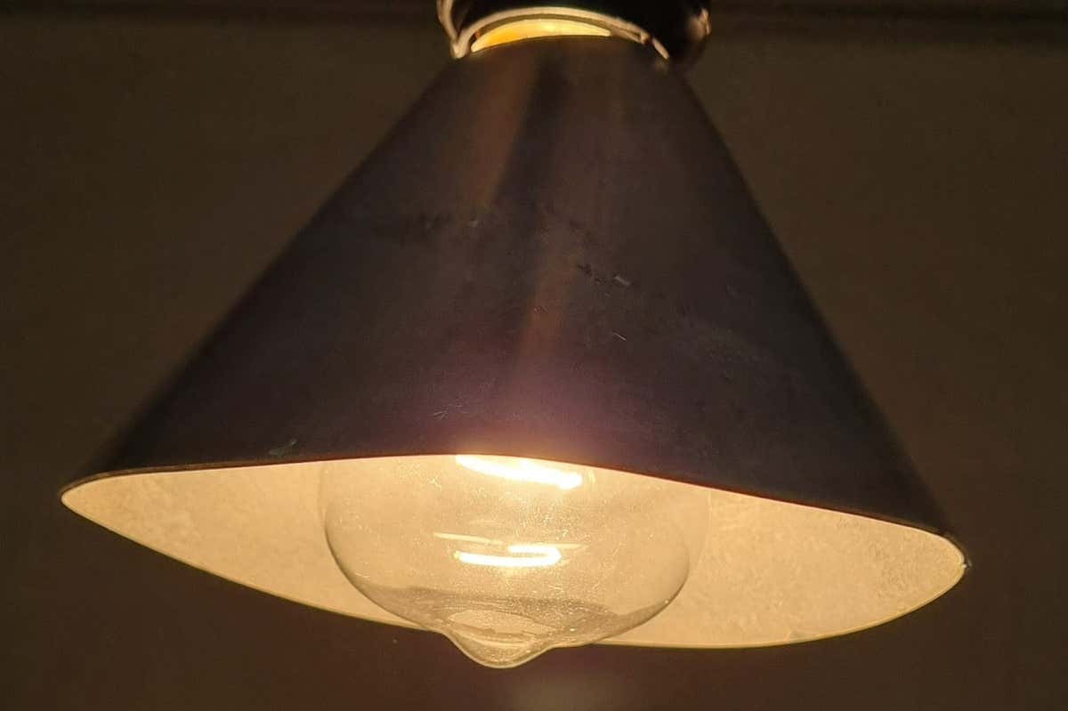 A lampshade coated with an iron and copper substance uses heat from the lightbulb bulb to convert air pollutants into small amounts of carbon dioxide and water
