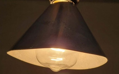 A lampshade coated with an iron and copper substance uses heat from the lightbulb bulb to convert air pollutants into small amounts of carbon dioxide and water