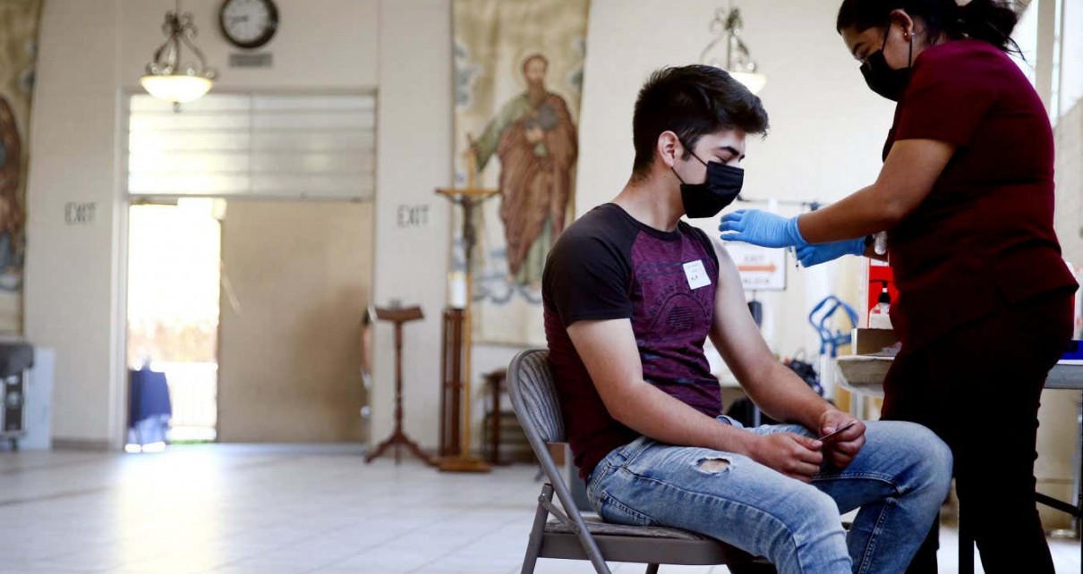 Someone being vaccinated against covid-19 in LA, California, in April 2021