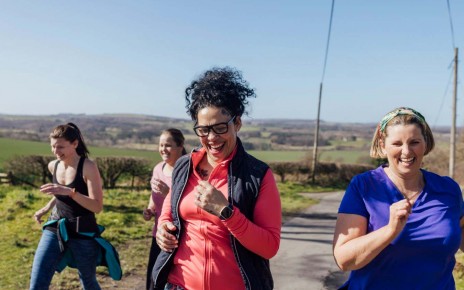A group of women jogging uphill in County Durham, UK