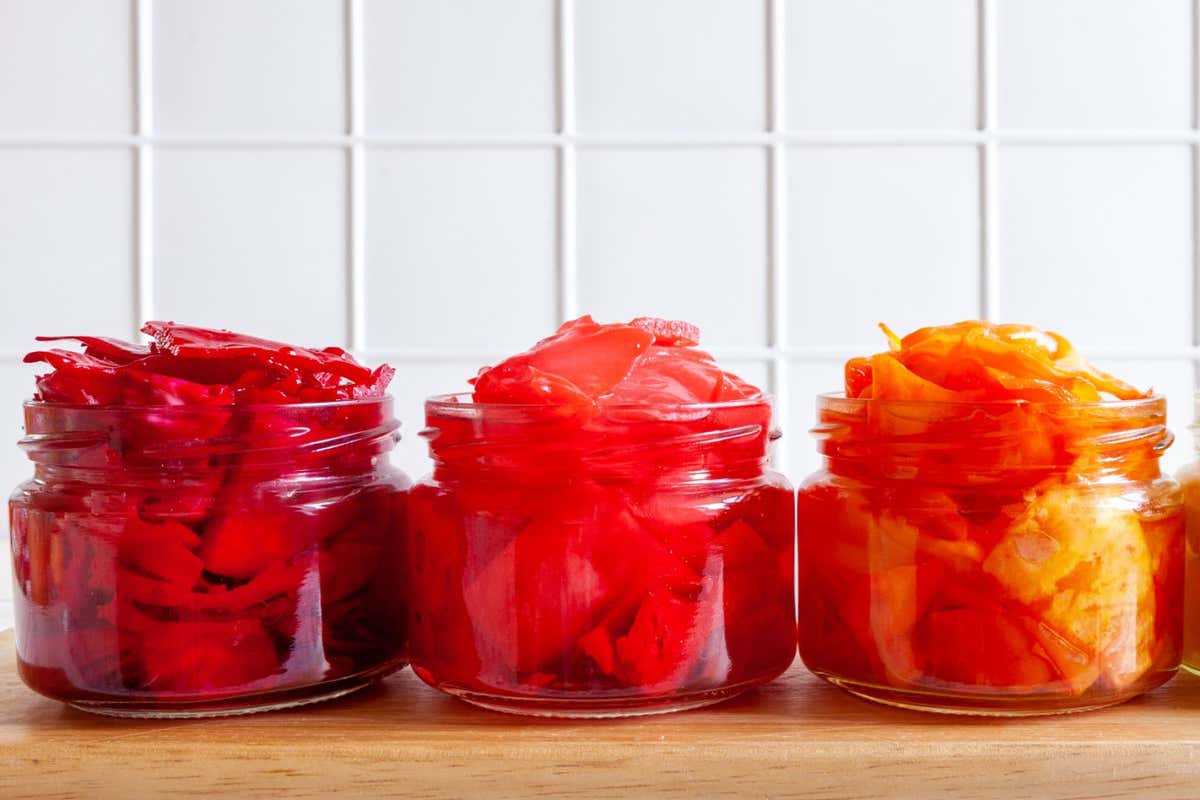 Close-up of multi-colored organic Cabbage in glass jars, fermented with various seasonings and other vegetables, postbiotic and probiotic food