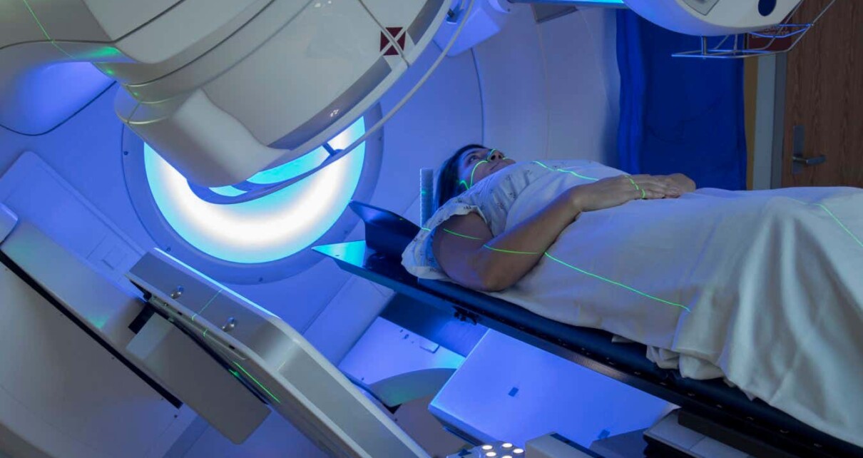 A woman receiving radiation therapy for breast cancer