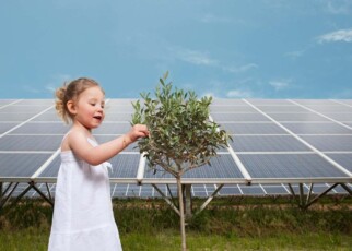 BF3CDY girl and tree in front of solar panel
