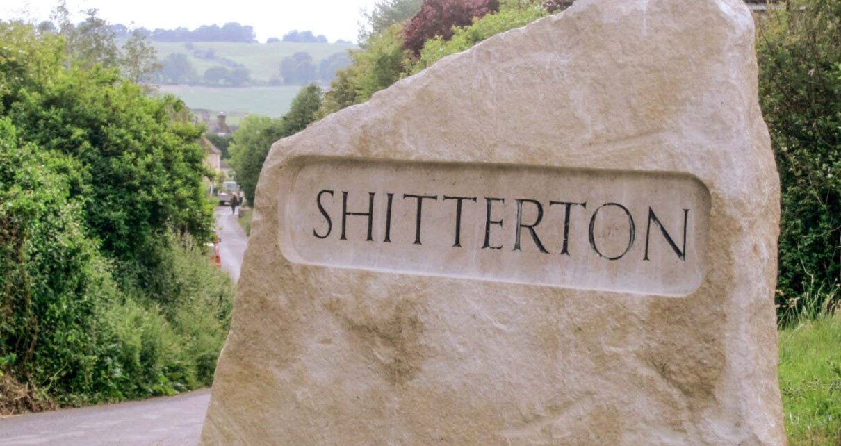 A street sign of Shitterton in Dorset, England