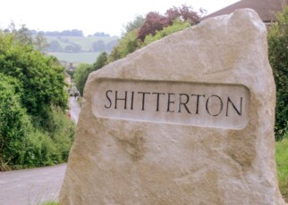 A street sign of Shitterton in Dorset, England