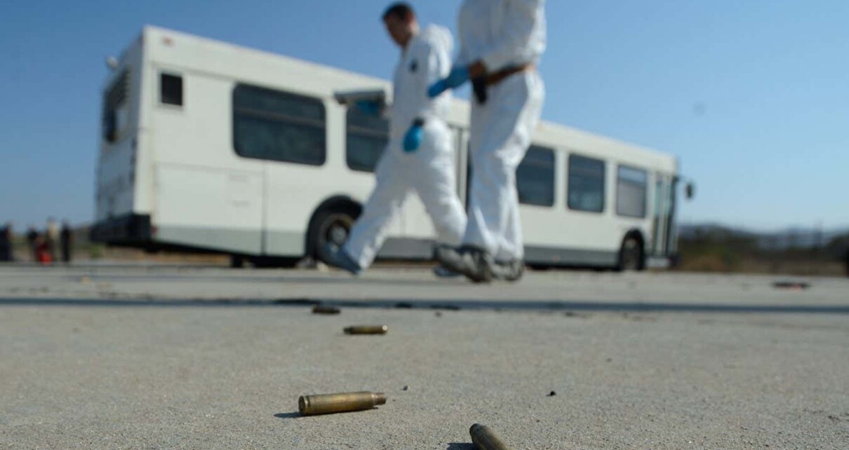 Bullet shells on the ground as members of the FBI practice their investigation techniques