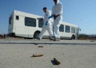 Bullet shells on the ground as members of the FBI practice their investigation techniques