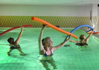 People with long covid, who were not participants in the latest trial, take part in an exercise programme in a swimming pool