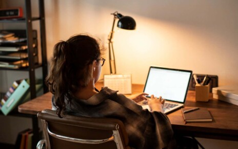 Teen girl doing homework on her laptop; Shutterstock ID 1251579397; purchase_order: -; job: -; client: -; other: -