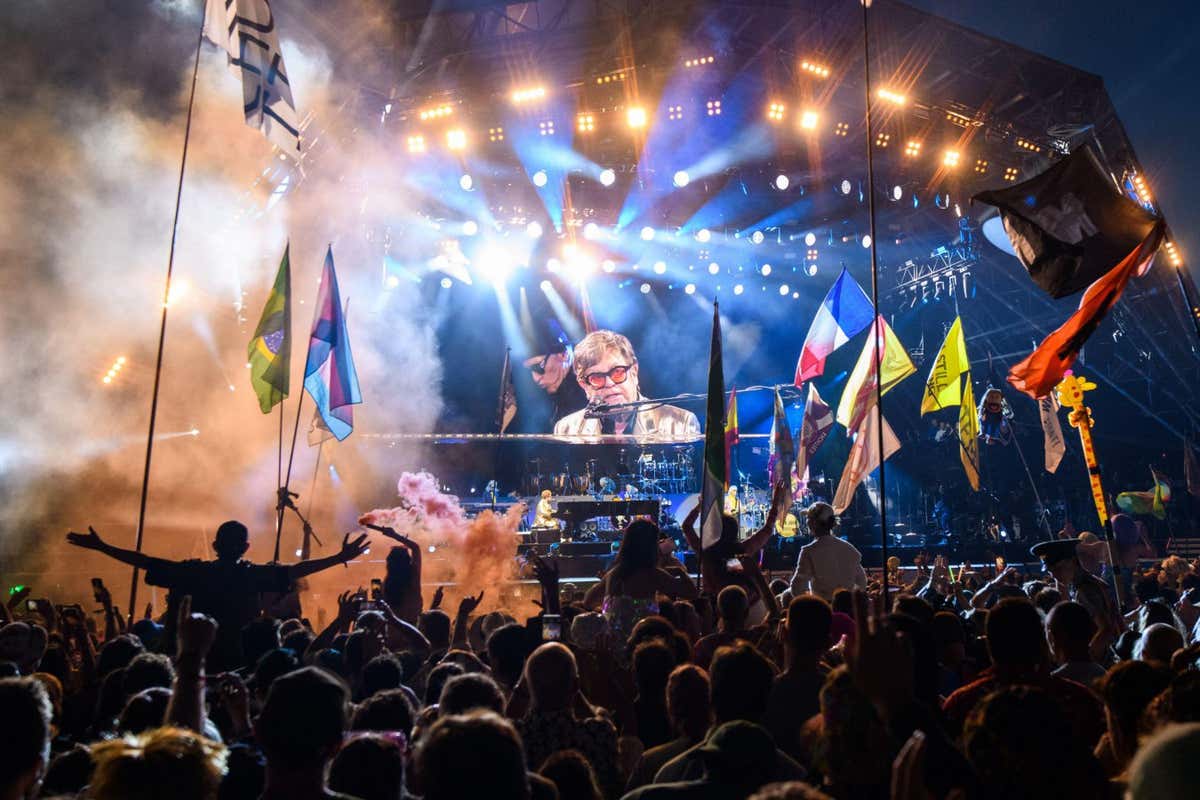 Elton John playing the piano at Glastonbury Festival in June 2023