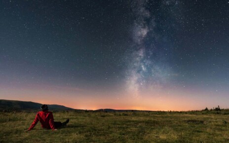 A young man lying on the grass and watching the Milky Way. Taken in A Veiga, Orense.