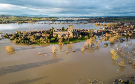 TEWKESBURY, UNITED KINGDOM - JANUARY 05: Flood water surrounds Tewkesbury Abbey and surrounding streets because of widespread flooding after the Rivers Swilgate and Avon burst their banks on January 5, 2024 in Gloucestershire, England. Storm Henk brought strong winds and heavy rain across much of the country this week which lashed large parts of the country, hitting travel and cutting power. While across the UK numerous flood warnings were still in place after weeks of heavy rainfall, the UK's Environment Agency has warned people to expect flooding to become more frequent because of climate change. (Photo by Anna Barclay/Getty Images)