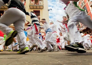 People run from bulls in Pamplona, Spain