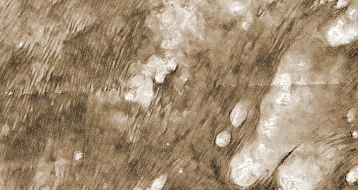 Titan’s sand dunes may be made of smashed up small moons