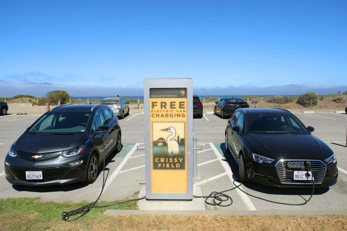 A free electric car charging station being used