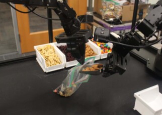 This robot can respond to verbal commands and corrections on the fly.