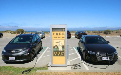A free electric car charging station being used