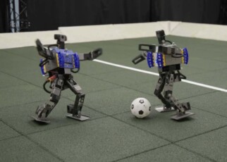 Watch mini humanoid robots showing off their football skills
