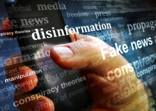 Illustration of a computer screen showing words including disinformation and fake