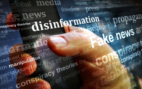 Illustration of a computer screen showing words including disinformation and fake